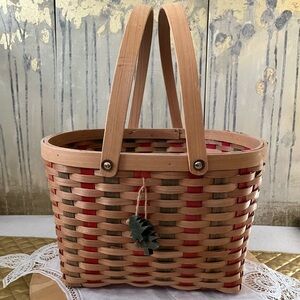 Wicker And Bamboo Tan, Red And Green Striped Basket With 2 handles and trees